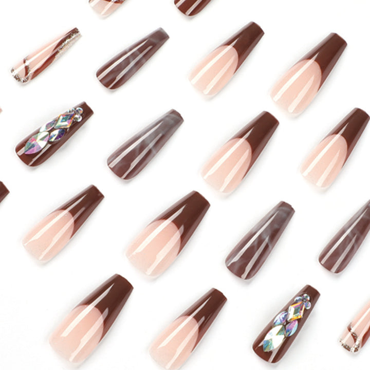 Artificial nail extensions with elegant gemstone embellishments Kalsten