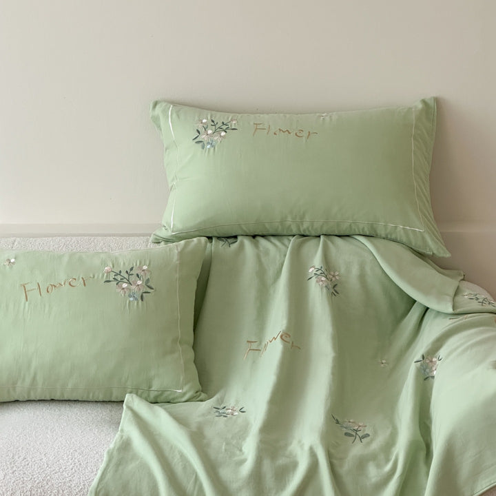 Delicate embroidered cotton bedding set with gentle botanical embroidery and bow ties Kalsten