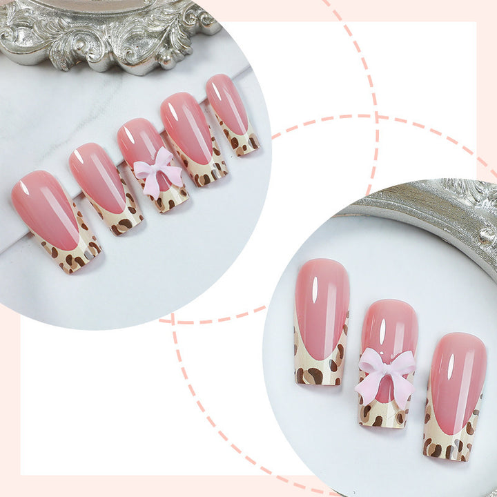 Nail set with elegant leopard accents and bow embellishments Kalsten