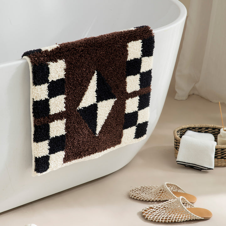 Tufted, soft bath mat with geometric ethnic pattern and non-slip underside Kalsten