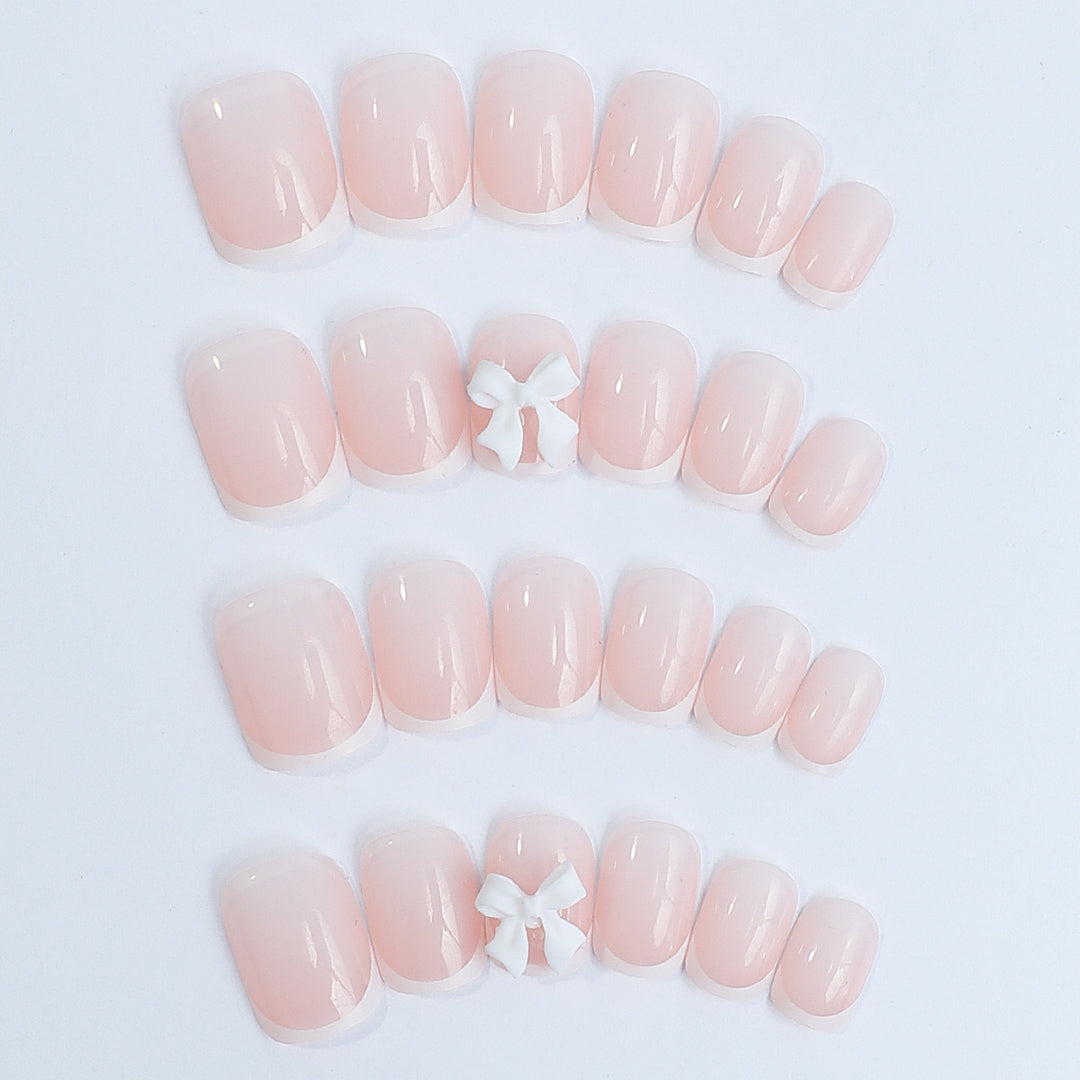 Nail set with elegant French tips and romantic floral decorations Kalsten