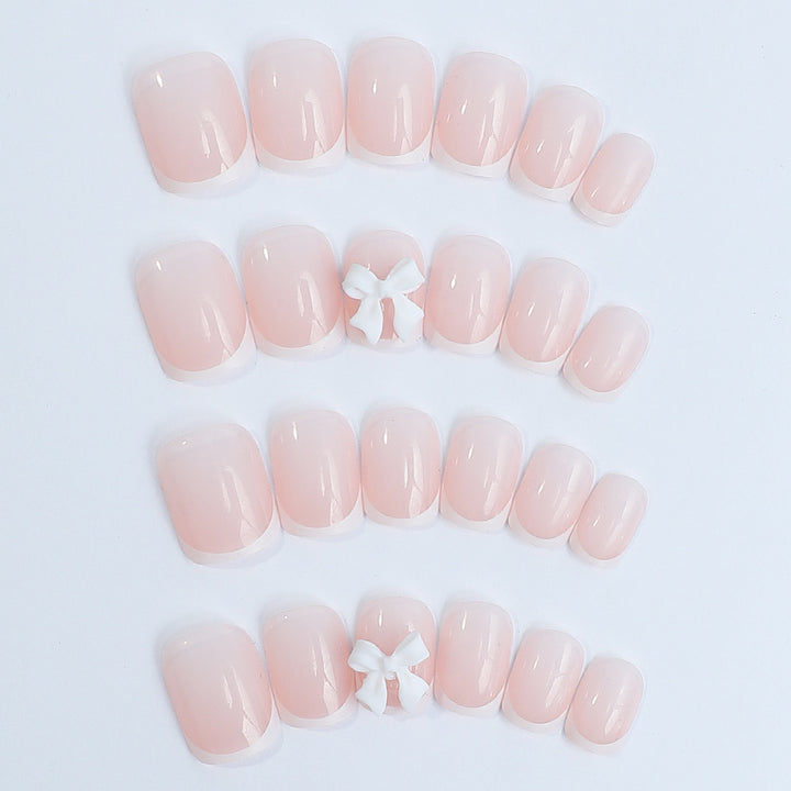 Nail set with elegant French tips and romantic floral decorations Kalsten