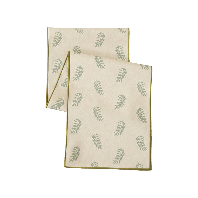 Woven table runner in botanical leaf pattern made of cotton blend Kalsten