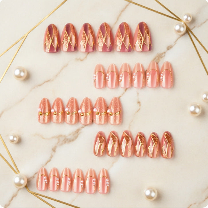 Artificial nails with elegant pearl and gold accents Kalsten