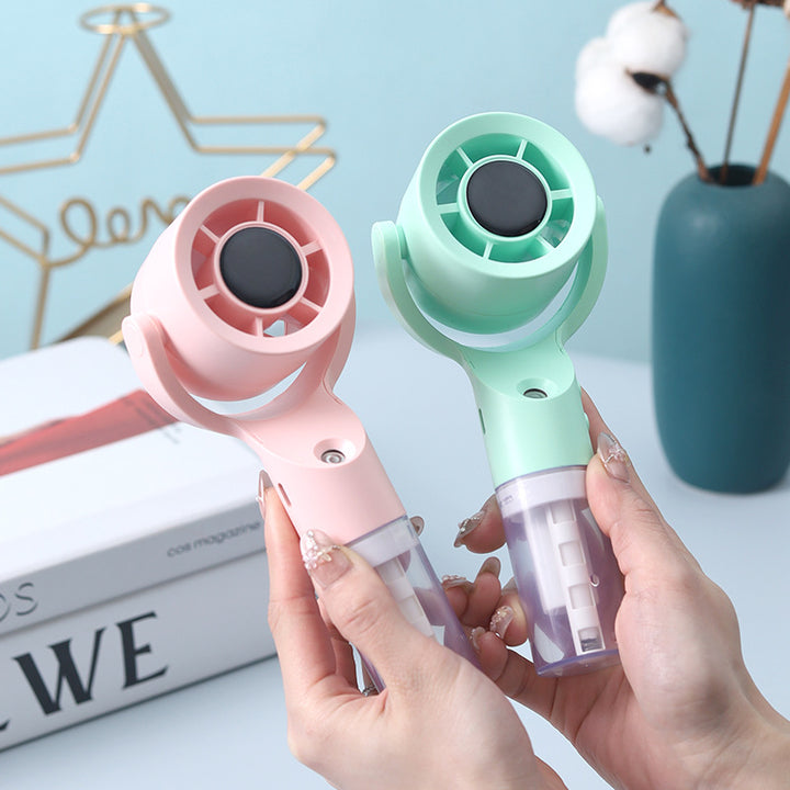 Cooling handheld misting fan with swivel air head detachable water reservoir and USB rechargeable battery Kalsten