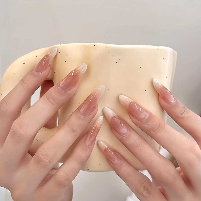 Artificial nails in the elegant French tip design Kalsten