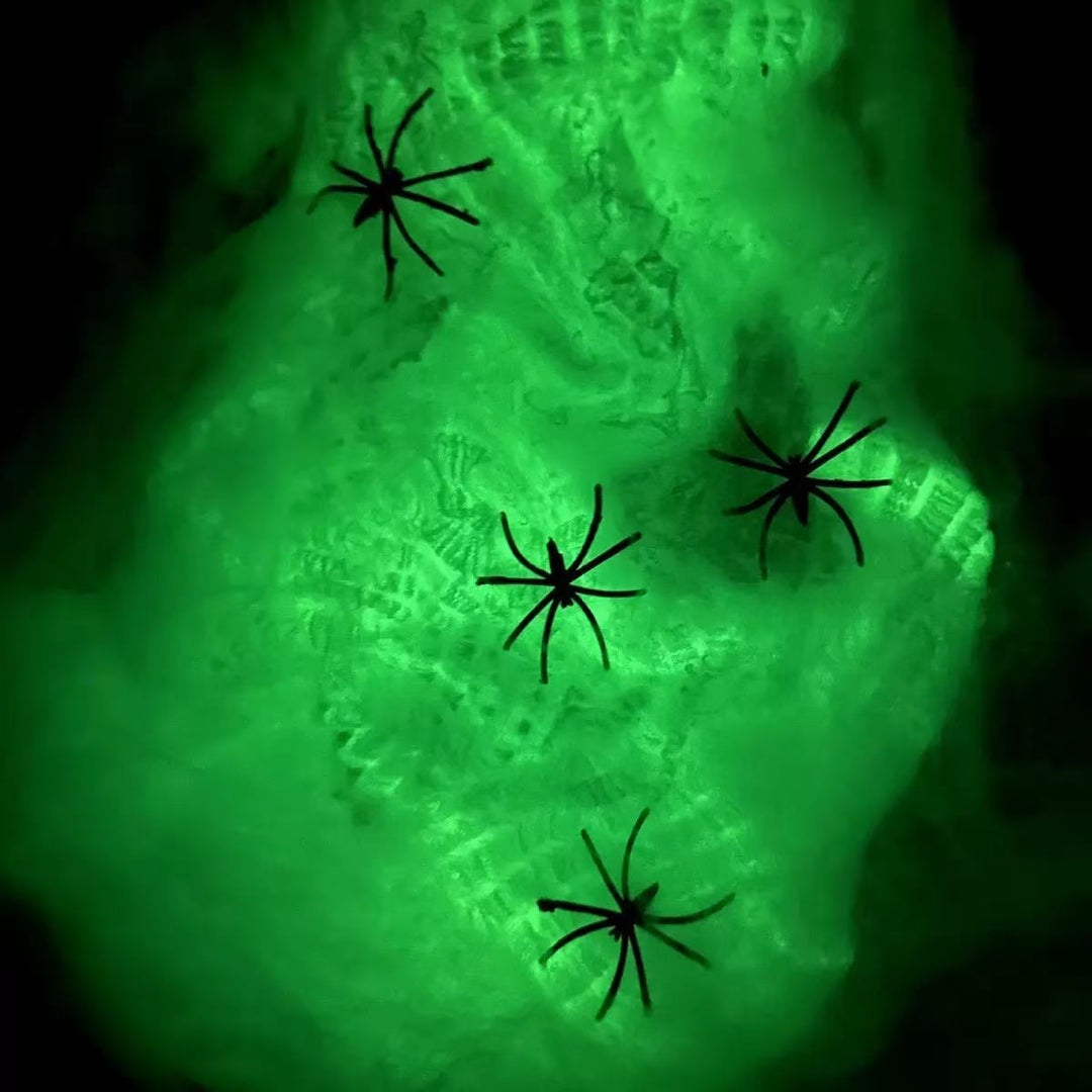 Decorative Halloween spider web with artificial spiders