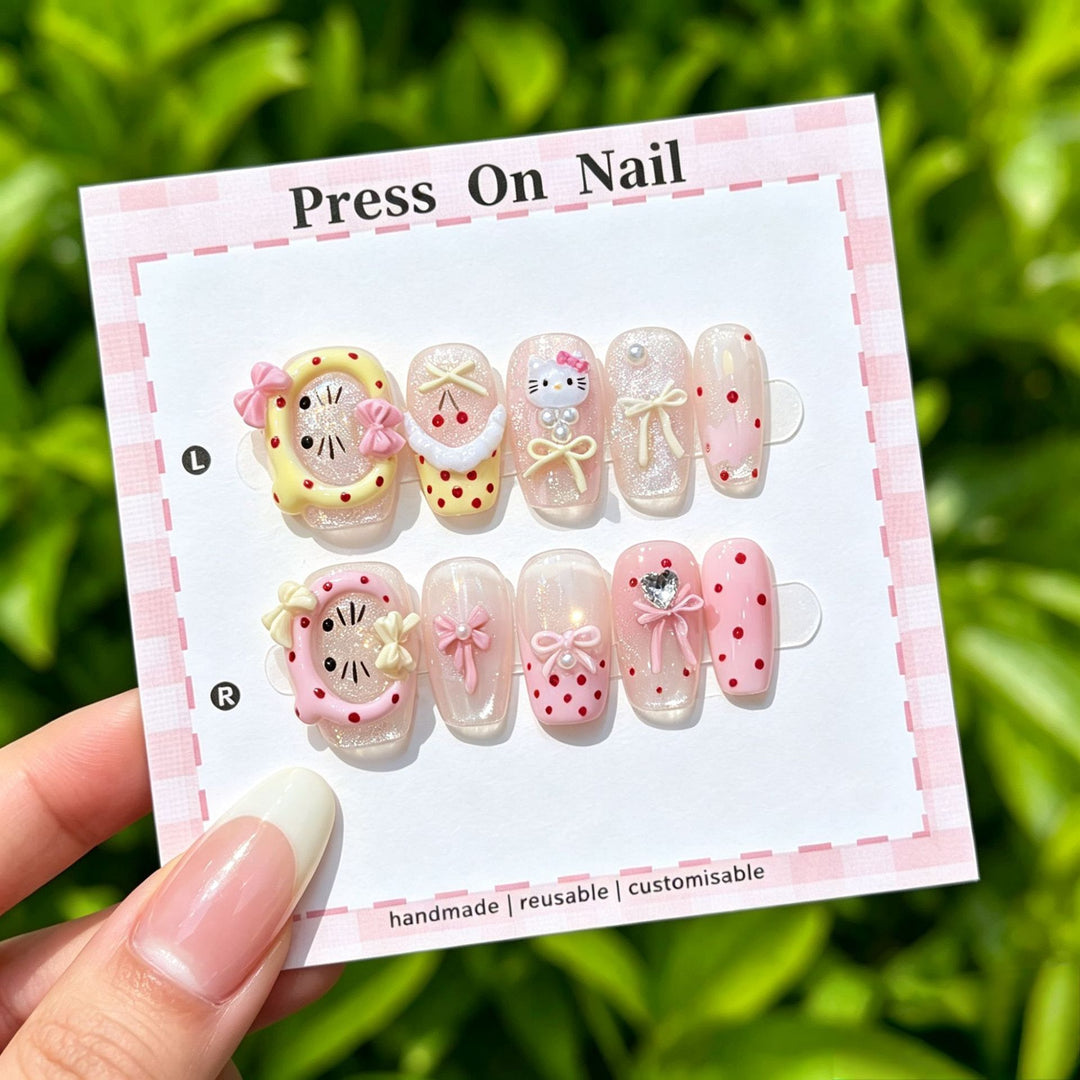 Artistic Press-On Nail Art Set with Cute Character and Bow Accents