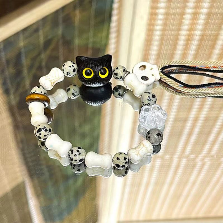 Whimsical Cat and Bone Charm Bracelet Kalsten