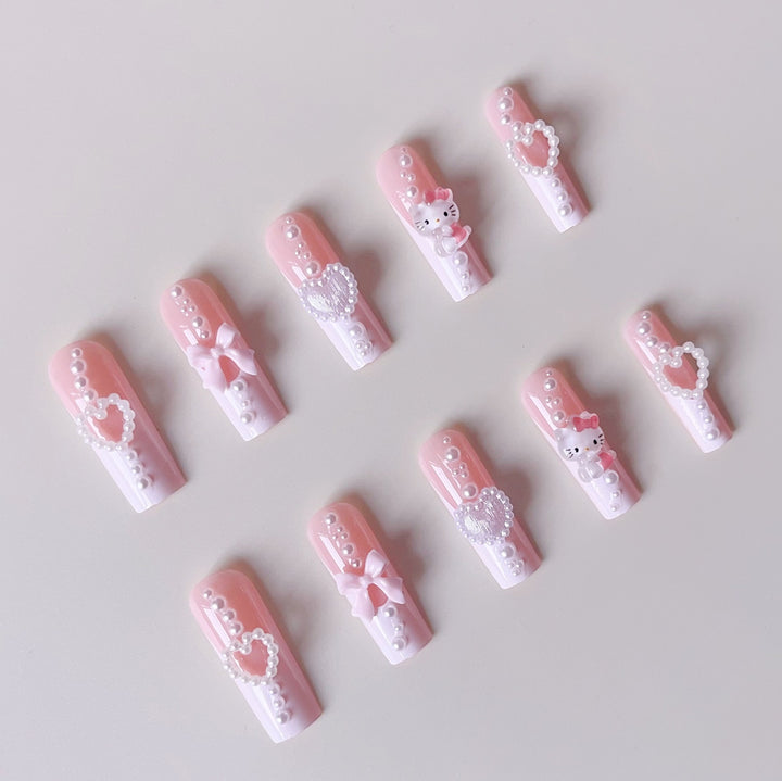 Artificial nail set with playful 3D care and pearl decorations Kalsten