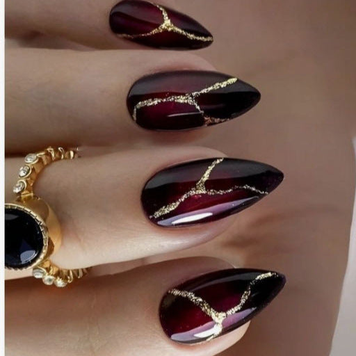 Artistic Press-On Nail Design with Gold Veining Accents Kalsten