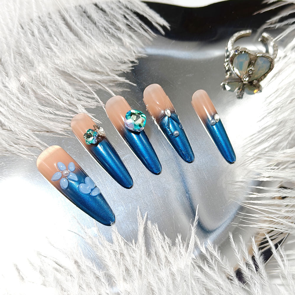 Artificial nails in elegant design with artistic decorations and glitter accents Kalsten