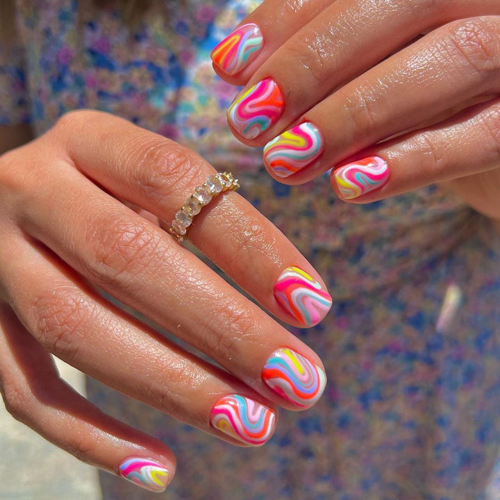 Acrylic nail set with colorful marble design and vibrant colors Kalsten
