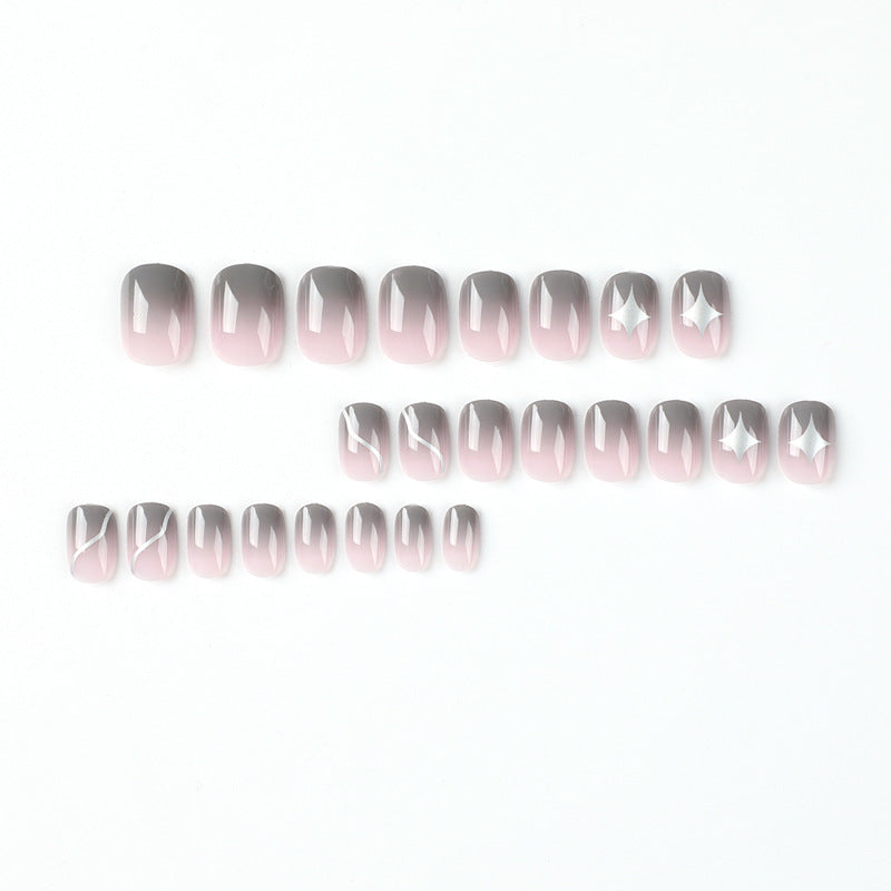 Artificial nail art with elegant ombre design and charming accents Kalsten