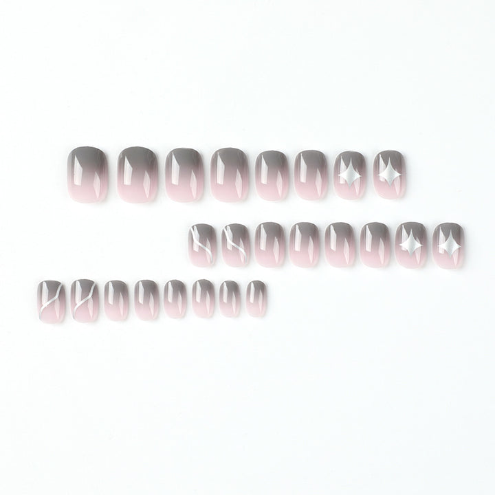 Artificial nail art with elegant ombre design and charming accents Kalsten