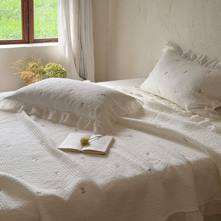 Quilted bedspread and cushion set with frill and delicate flower embroidery