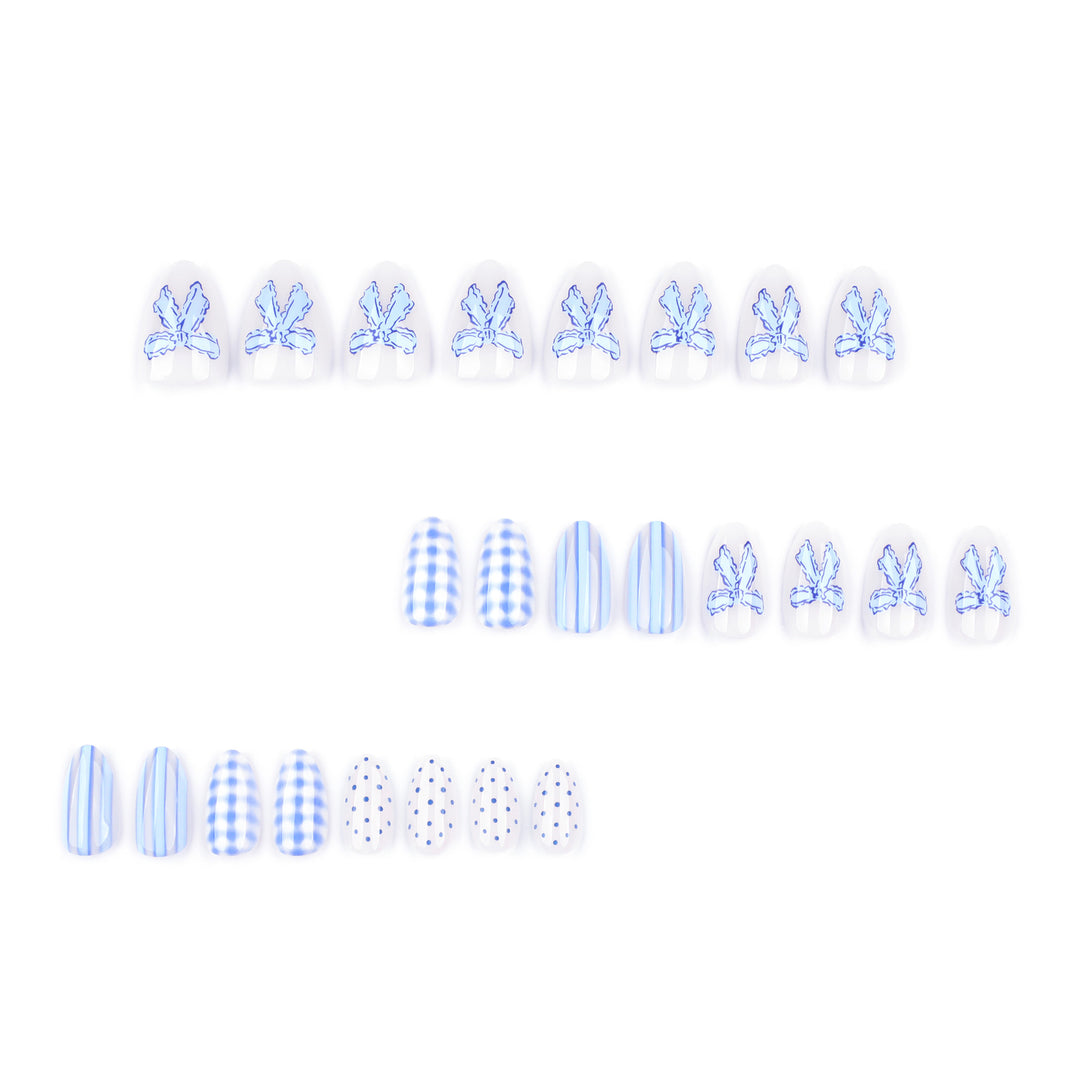 Artistic Nail Art with Floral and Polka Dot Designs Kalsten