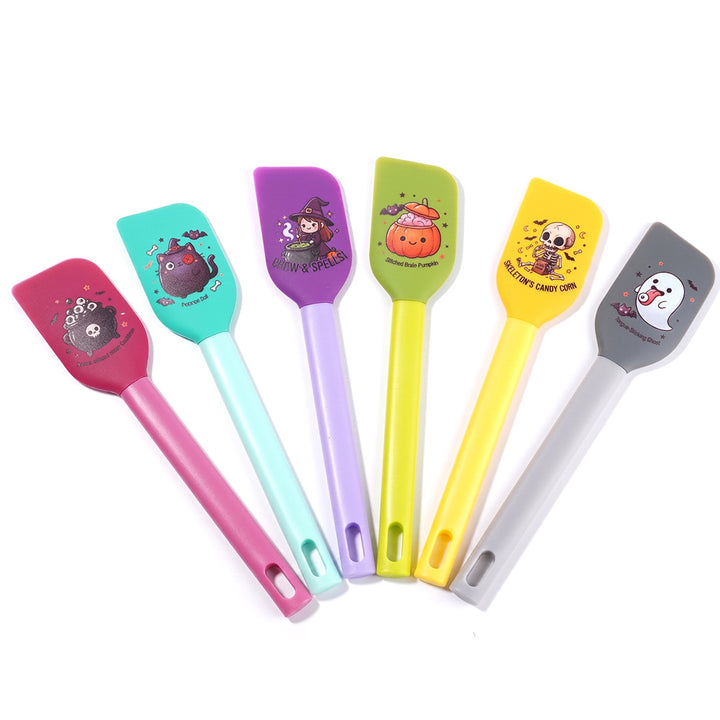 Silicone kitchen spatula with flexible scraper and child-friendly witch motif