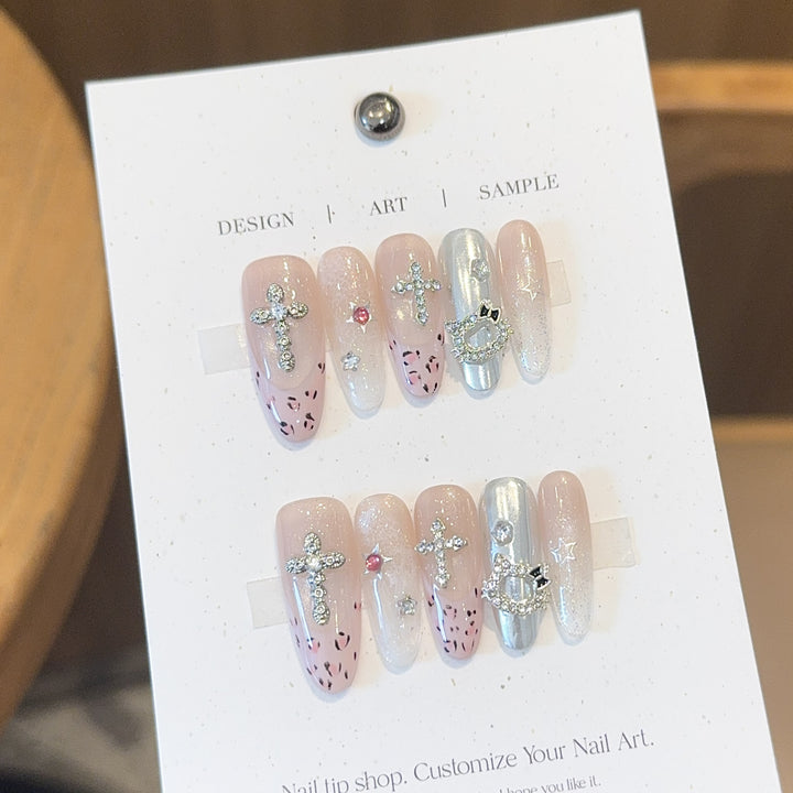 Artificial nails with sparkling rhinestones and cross motifs Kalsten