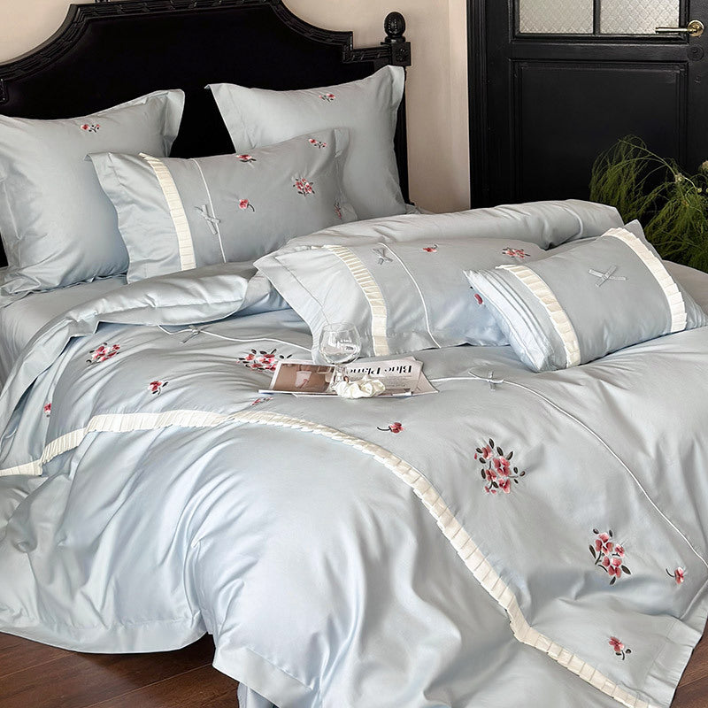Elegant cotton satin bedding set with fine rose embroidery and pleated ruffle