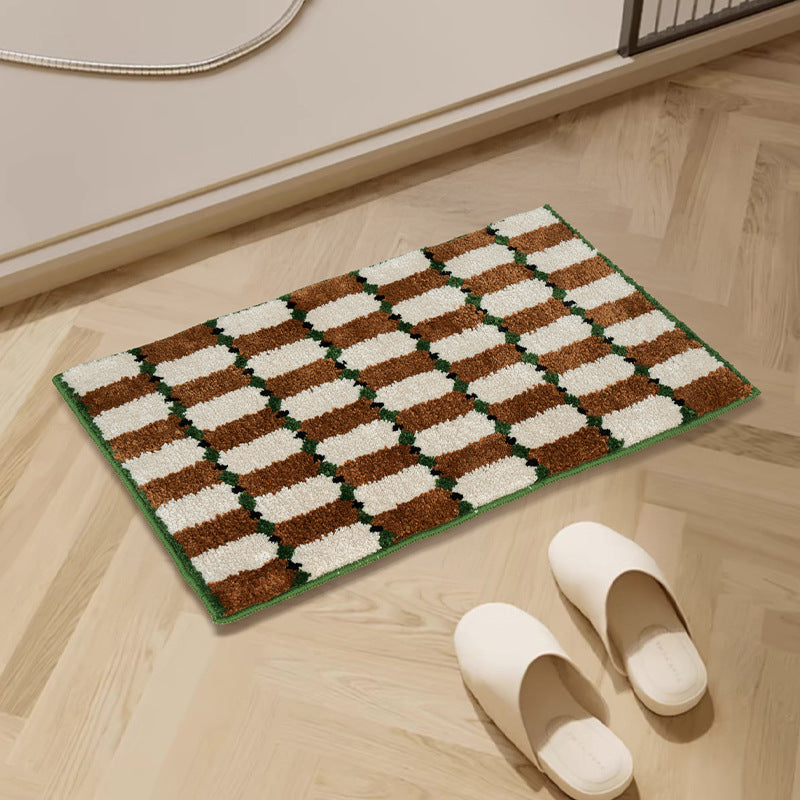 Hand-tufted bathroom mat with a velvety pile, non-slip latex backing, and geometric honeycomb check pattern Kalsten