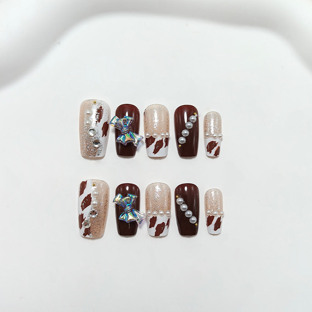 Artificial nails with glamorous rhinestone and bow design Kalsten