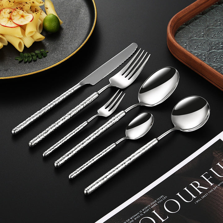 Elegant dessert spoon with elaborate handle design Kalsten