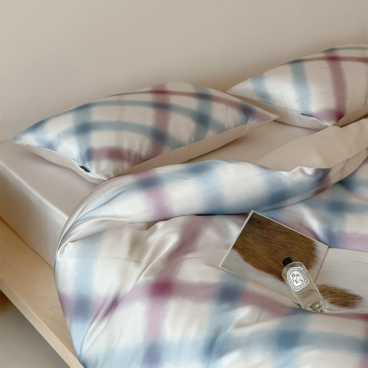 Luxurious satin bedding set with floral watercolor print, ruffled edges and reversible function