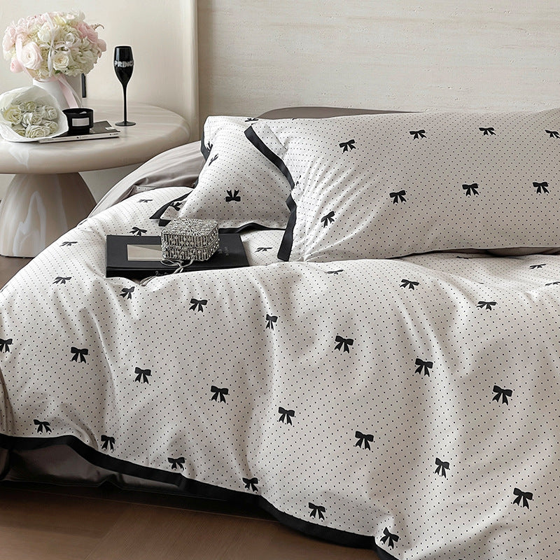 Luxurious cotton satin bedding set with butterfly motif and contrasting frame edge