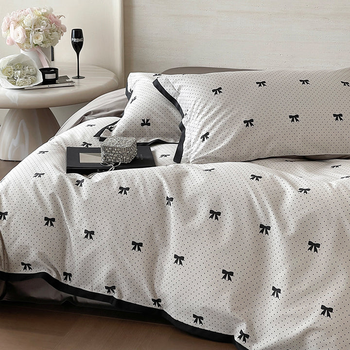 Luxurious cotton satin bedding set with butterfly motif and contrasting frame edge
