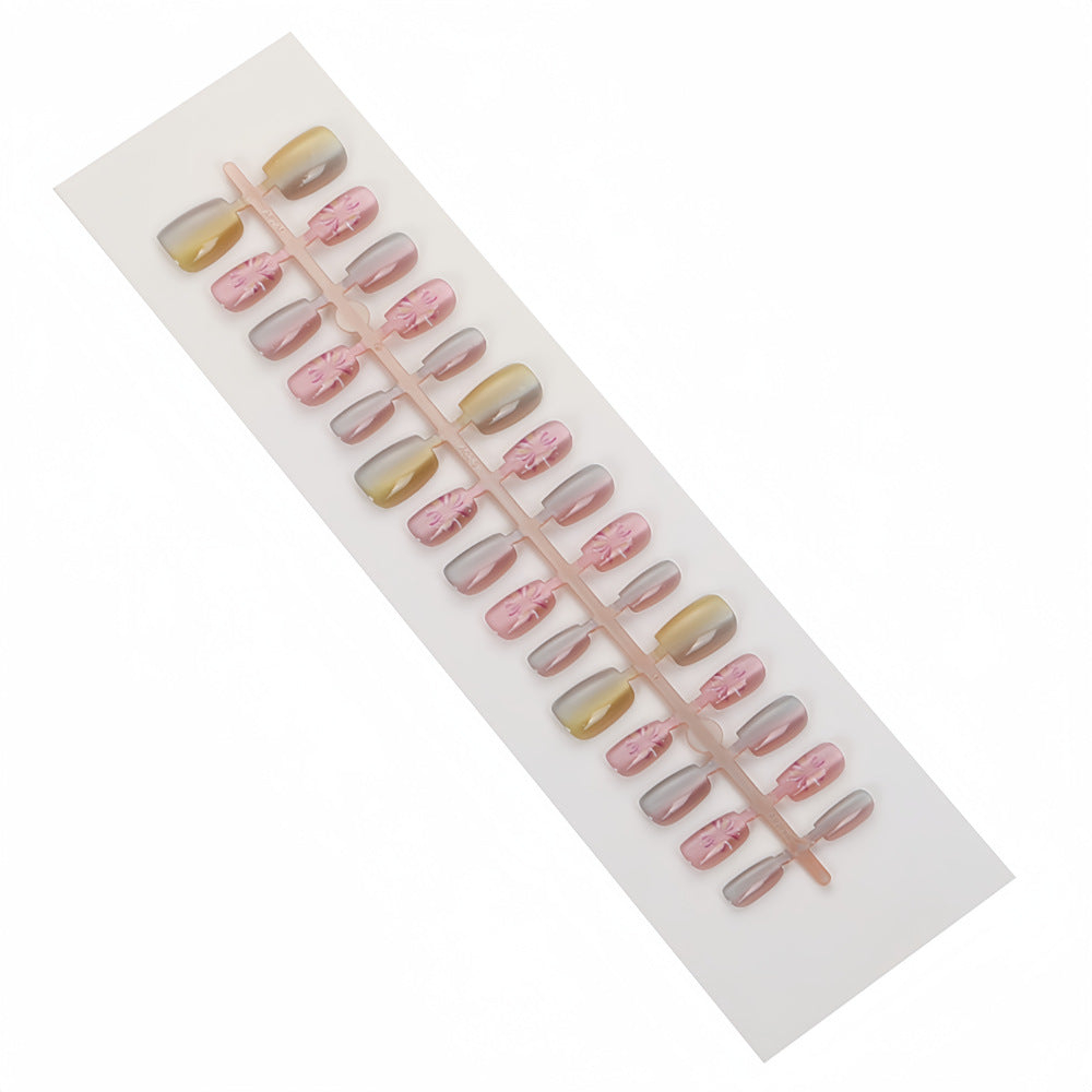 Artificial nails in modern ombre design with floral accents Kalsten