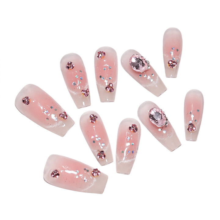 Artificial nail extensions with artistic glitter accents Kalsten