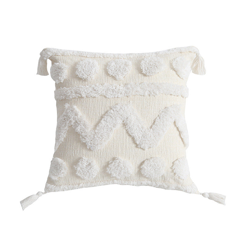 Rectangular decorative cushion cover with hand-tufted chevron and pompom relief as well as corner tassels Kalsten
