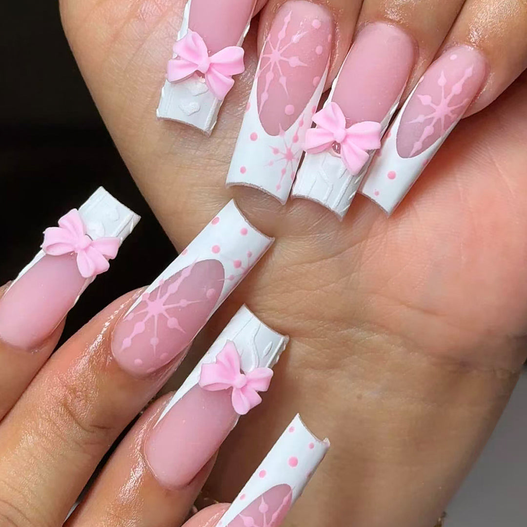 Artificial nail tips with playful bows and snowflake design Kalsten