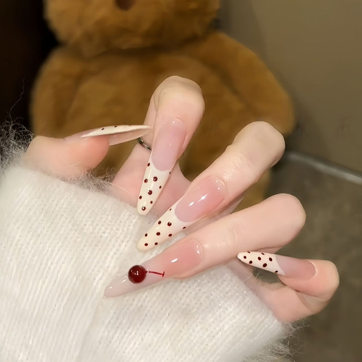 Artificial nails with playful design and cherry accents Kalsten