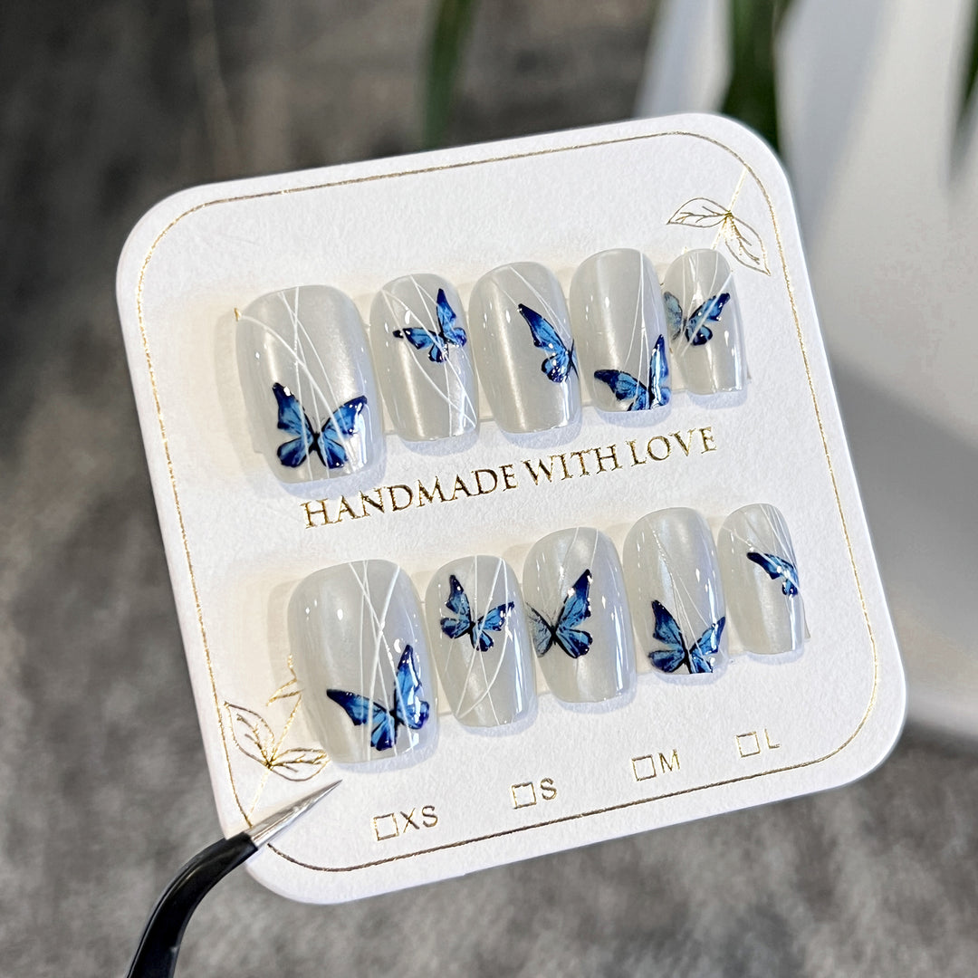 Creative nail extensions with intricate butterfly design Kalsten
