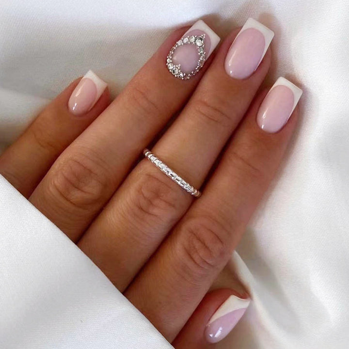 Artificial nail set with elegant French design and rhinestone embellishments Kalsten