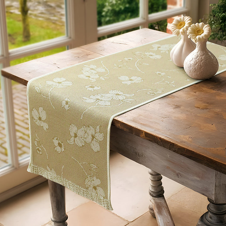 Woven table runner with floral jacquard pattern and fringed edge Kalsten
