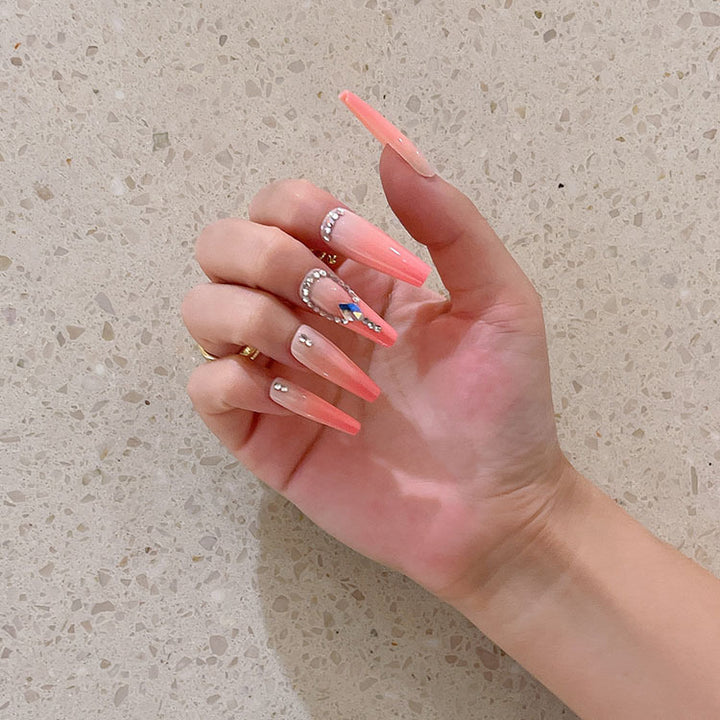 Artificial nails with glitter and stone embellishments Kalsten