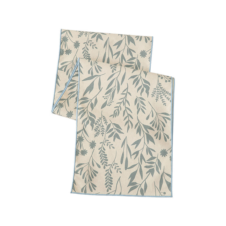 Woven table runner in botanical leaf pattern made of cotton blend Kalsten
