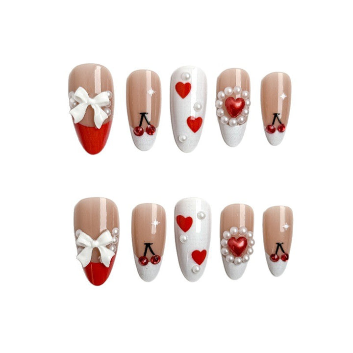 Creative nail art with heart and cherry motifs Kalsten