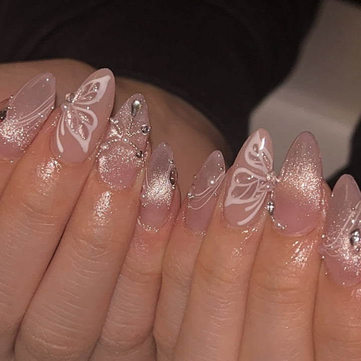 Artful nail extensions with delicate flower and glitter accents Kalsten
