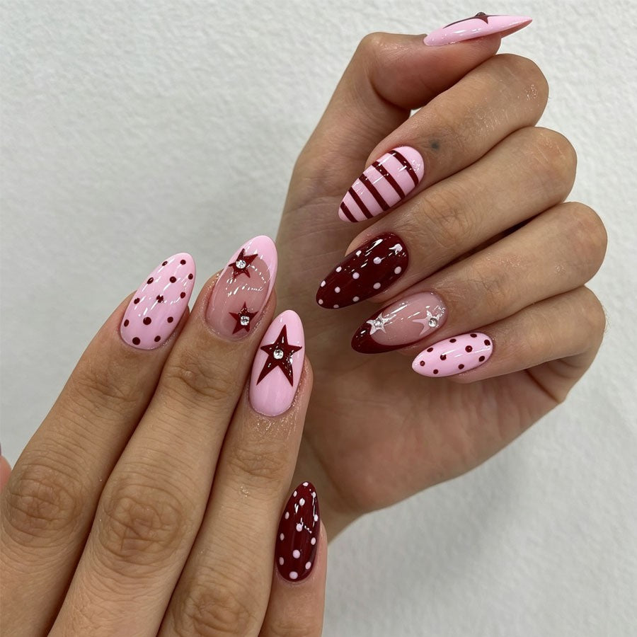 Artificial nail set with asymmetric designs and glitter accents Kalsten