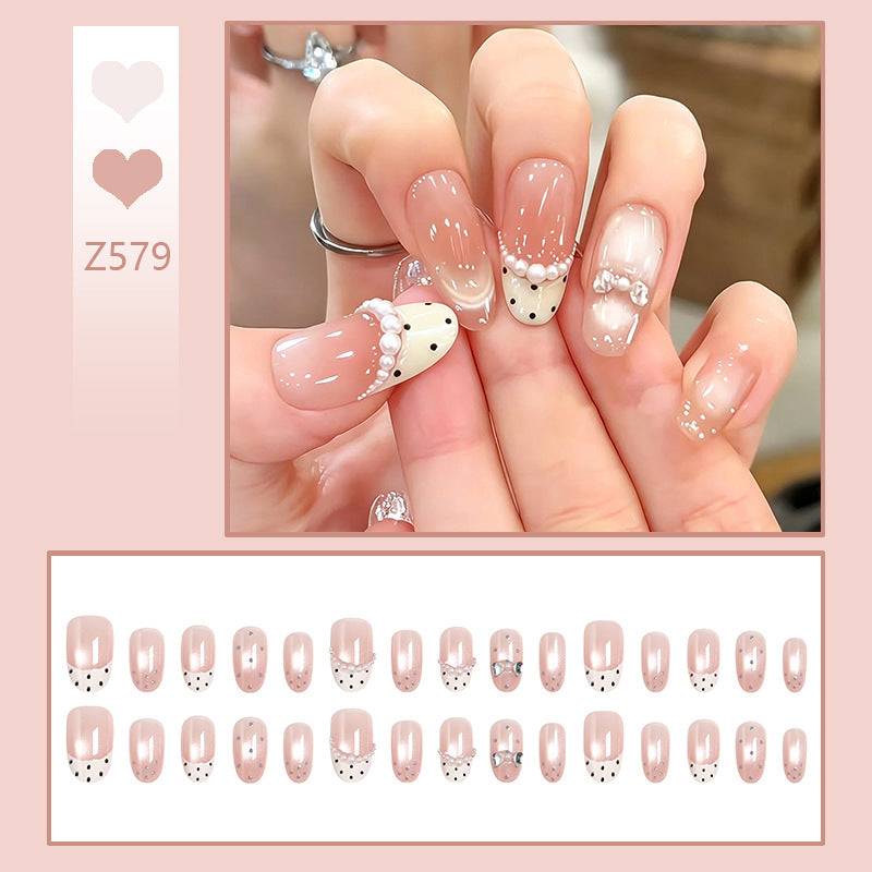 Artificial nail set with elegant French design and delicate pearl embellishments Kalsten