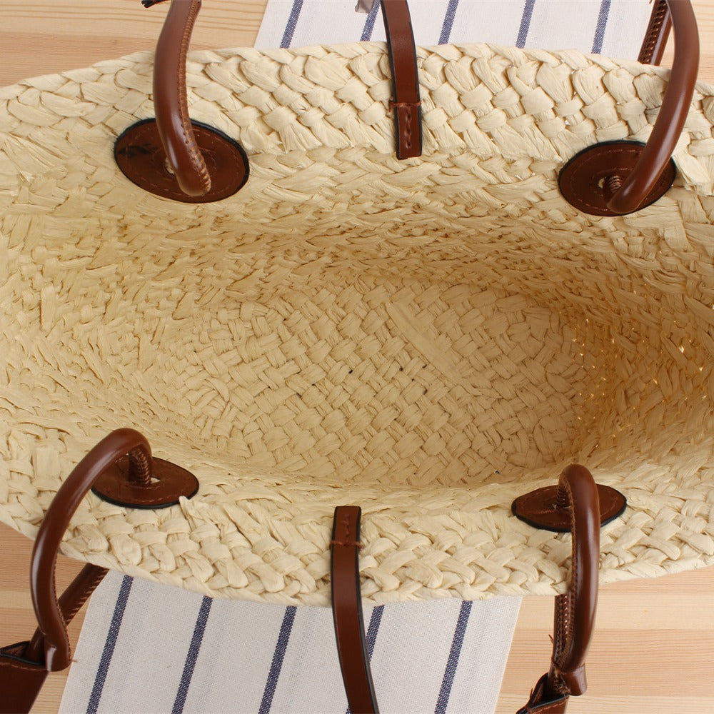 Beach bag made of high-quality braided straw with stylish leather handles Kalsten