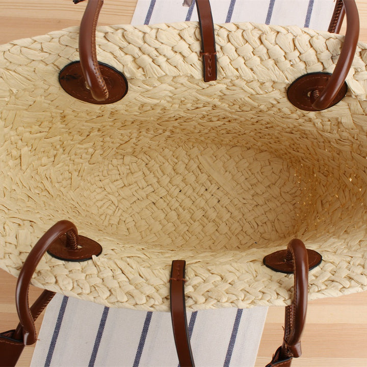 Beach bag made of high-quality braided straw with stylish leather handles Kalsten