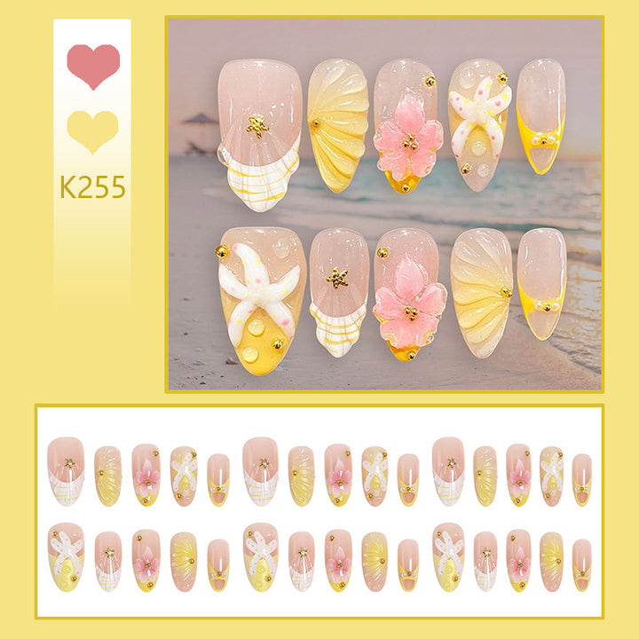 Artificial nail set with glamorous floral designs and creative glitter accents Kalsten