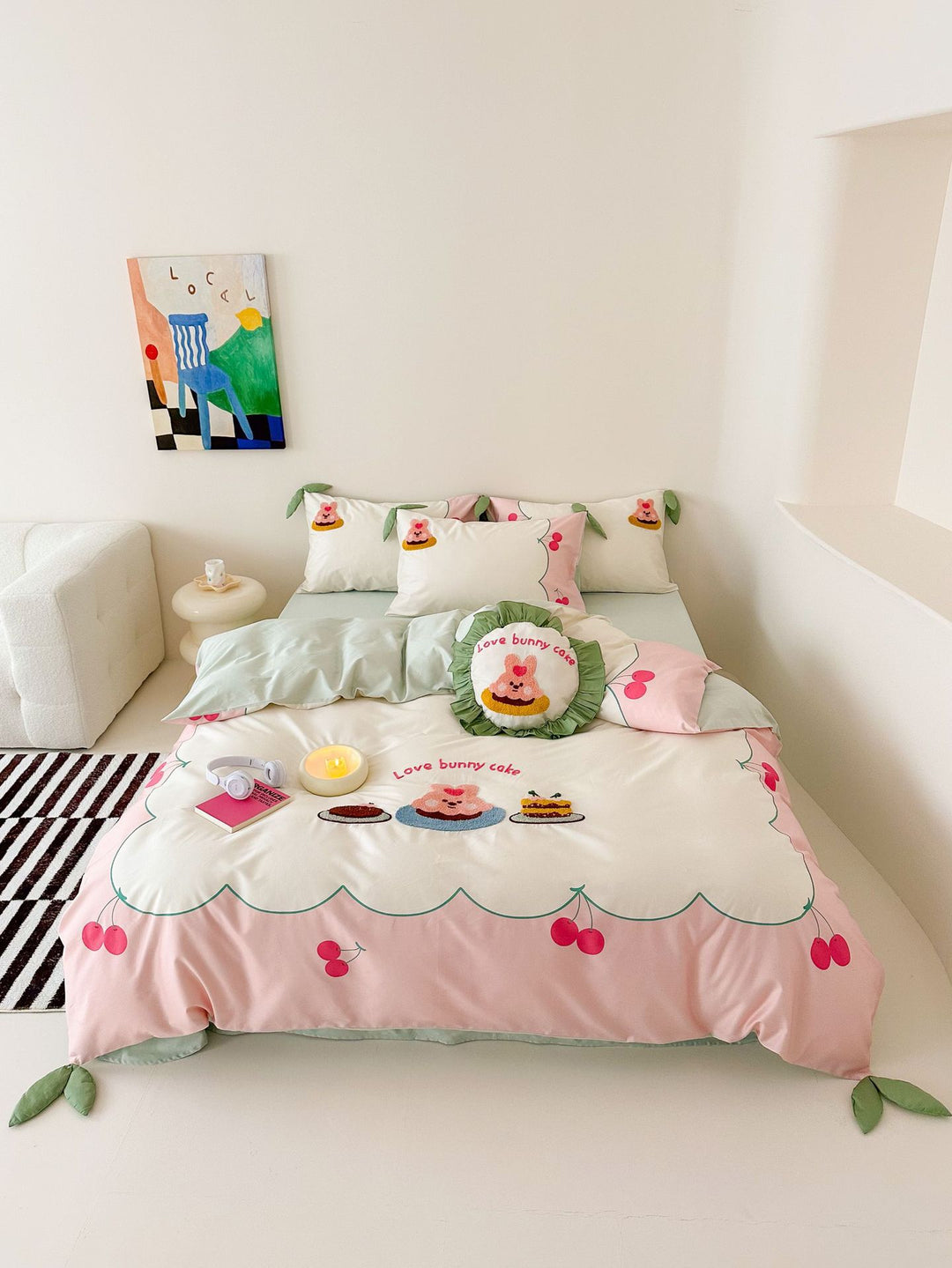 Playful cotton bedding set with embroidered bunny and cherry motif including decorative pillow