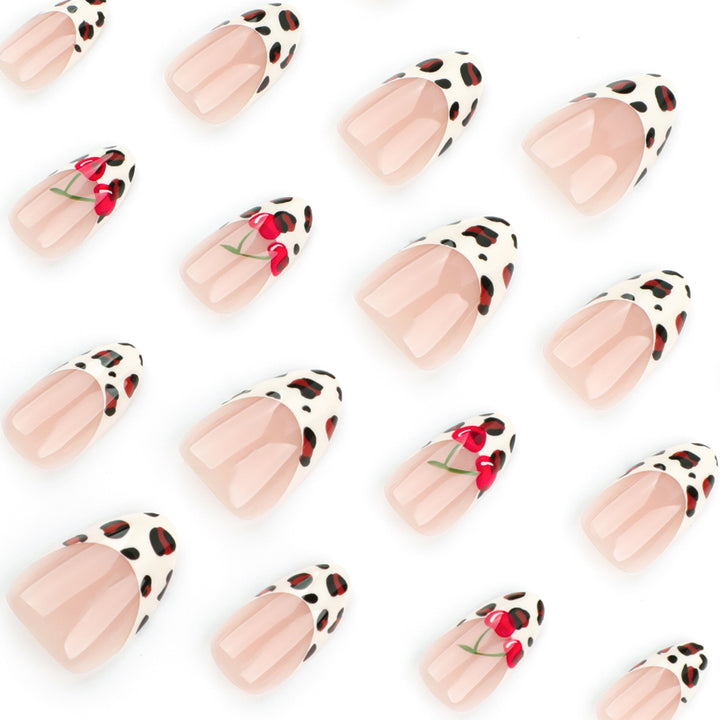 Artful animal pattern nails with cherry accents Kalsten