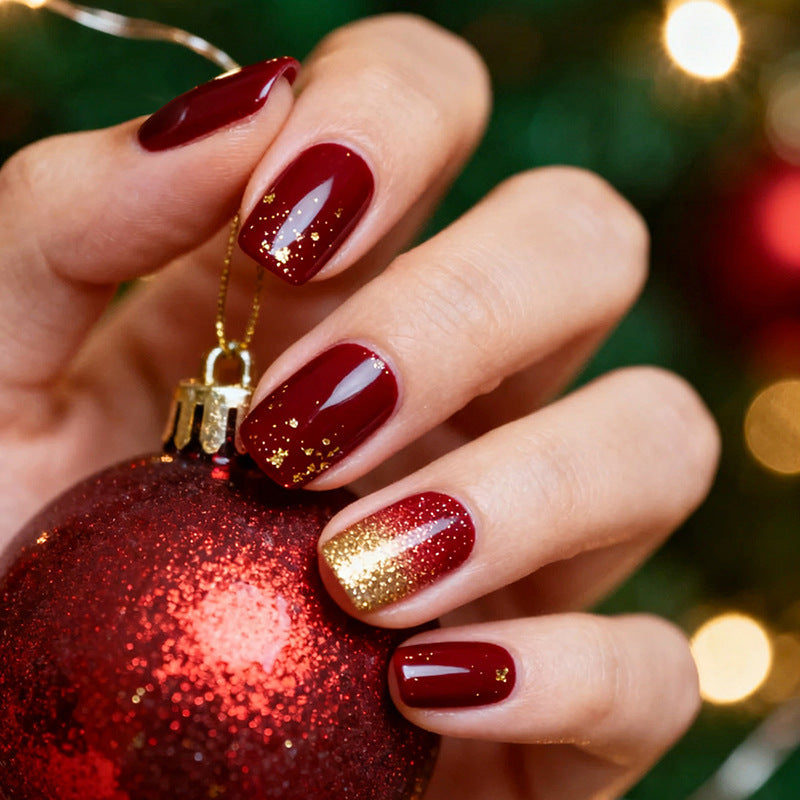 Acrylic nail set with sparkling accents and festive design Kalsten